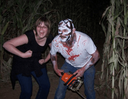 Scary Chainsaw Mask Guy and Happy Person Posing Together